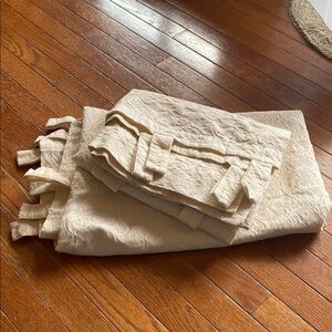 Elegant Cream Drapes with Textured Pattern